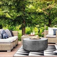 Rotondo Round Concrete Fire Pit Table by Prism Hardscapes with custom patina finish and circular design