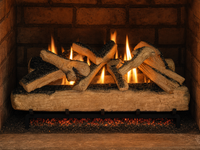 36" Western Pine Vented Gas Log Set | Hargrove — lit with warm flame