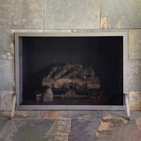 Free standing fireplace screen with solid steel frame and heavy gauge mesh, custom made in Wisconsin