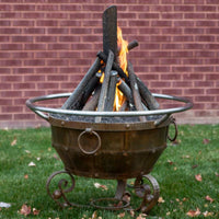 Round Mill Natural Gas Fire Pit 36-inch steel fire pit with rust patina and tee-pee stack logs