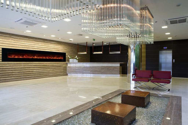 Modern Flames Ambiance 144-inch wall mount electric fireplace with vibrant flames in upscale hotel lobby