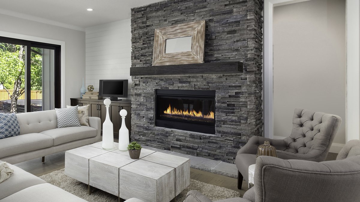 Grist Mill mantel in Eclipse finish in a bright living room illustration supplied by Lexington Hearth