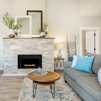 Empire DVL Linear 36 direct-vent fireplace with crushed glass media, living room