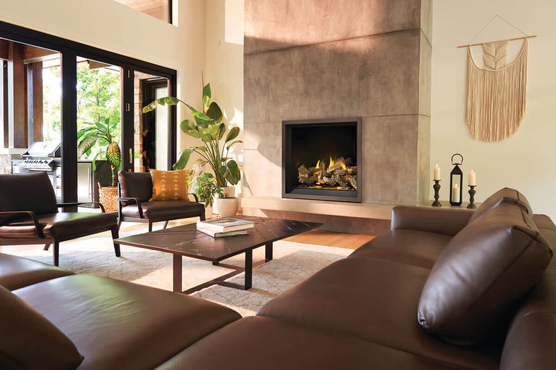 Napoleon Elevation X 42 gas fireplace lifestyle shot with oak logs and charcoal trim
