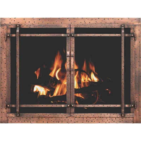 Aged iron rustic masonry fireplace glass doors with hand-finished patina