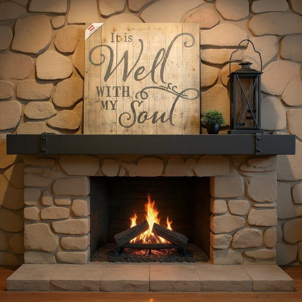 Custom blacksmith metal floating mantel shelf above fireplace in black finish