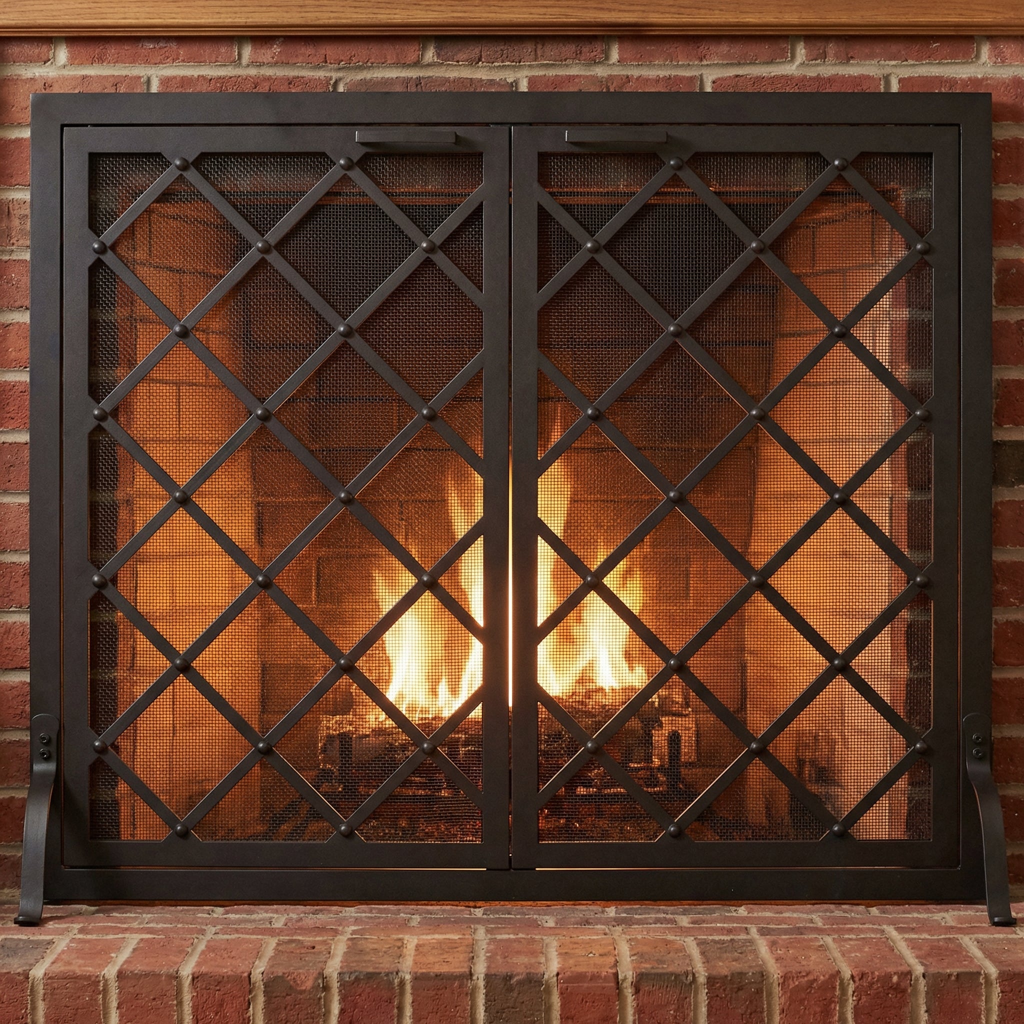 Custom free standing fireplace screen with thick solid steel frame and heavy gauge mesh in textured black