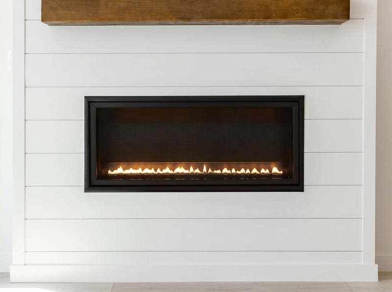 Empire Boulevard SL 30" Vent-Free Gas Fireplace — room setting. AI-assisted visualization; shown fronts, liners, media and surroundings may be optional.