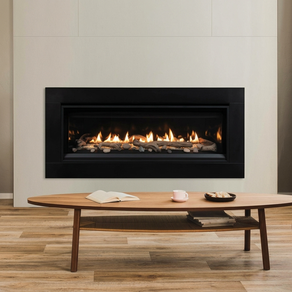 Superior DRL3555. Shown with optional black porcelain liner, driftwood logs, river rocks and wide black surround. AI-assisted editorial visualization preserving the manufacturer-photographed installation. Optional accessories are not represented as included in the base price. Installation must follow the supplied model-specific manual.