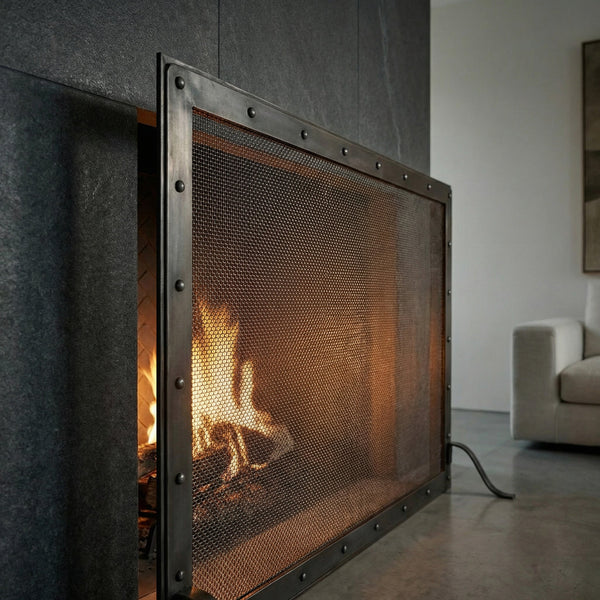Custom made black steel fireplace screen with heavy gauge mesh and 9-inch foot depth