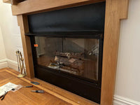 Rainbow Fireplace Glass Doors with aluminum frame and tempered safety glass installed in modern living room fireplace