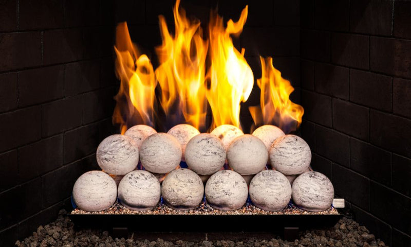 Real Fyre 24" 4-inch Carrera Marble Fyre Spheres Vented Set — original product reference. Arrangement and burner hardware vary by selected size and configuration.