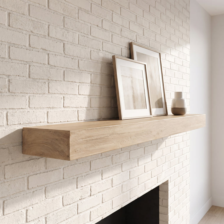 Pale Honey concrete mantel above a white brick fireplace