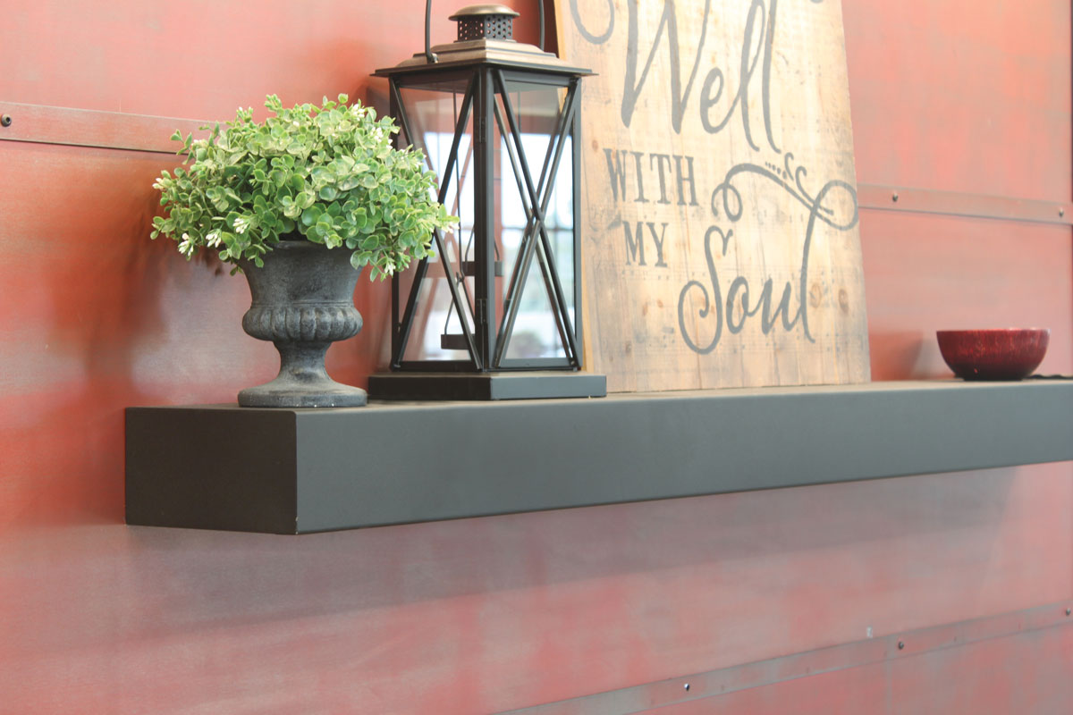 Clean metal mantel without decorative banding, shown against a warm metal wall
